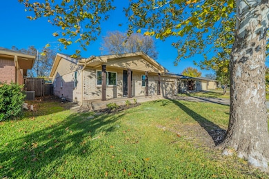 View of front of property featuring brick siding and a garage