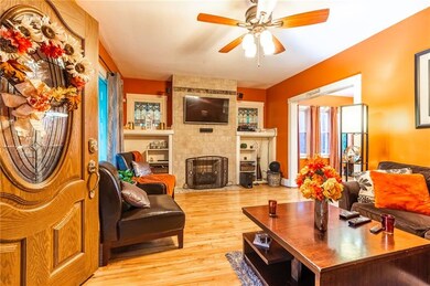 Large living room with fireplace and built in shel