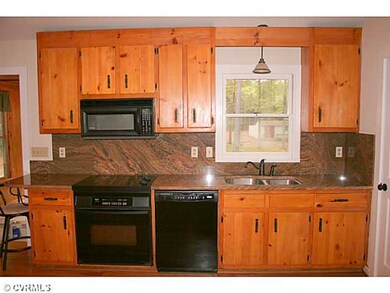 Kitchen - The kitchen features all black appliance