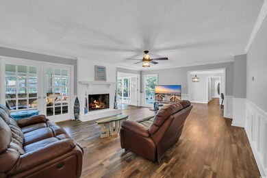 Living room featuring french doors, ornamental mol