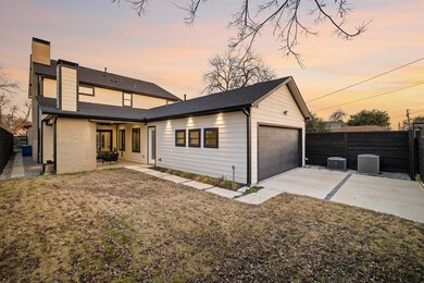 Back house at dusk featuring a patio, central AC, 