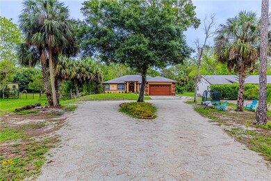 View of front of house featuring dirt driveway and