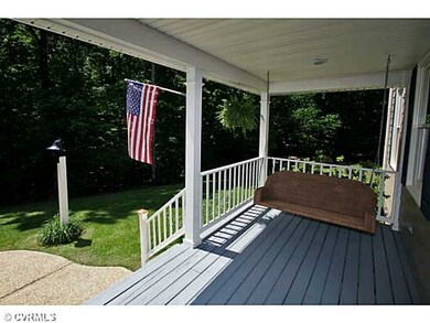 Exterior Front - Full country porch with swings