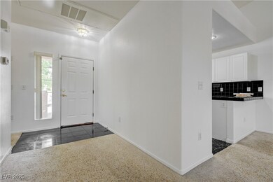 Foyer entrance with baseboards