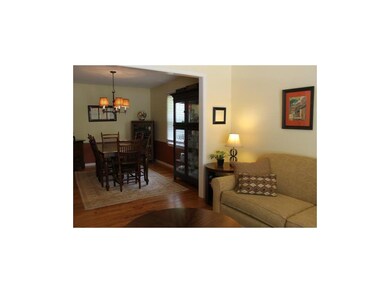 Spacious formal dining room boasts beautiful hardw