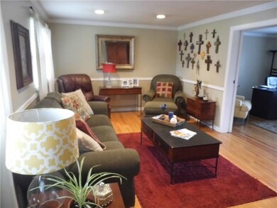 Stunning hardwood floors accent formal living comp