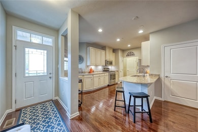 Gleaming hardwood floors greet visitors