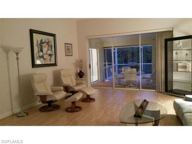 Living Room with stacking sliders opens to Lanai