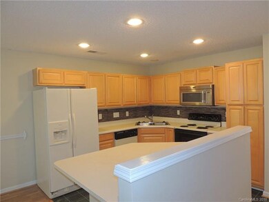 Kitchen features all appliances plus 2 seat island