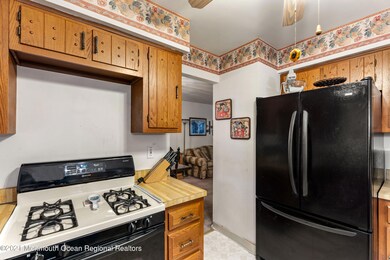KITCHEN OPENS TO DINING ROOM