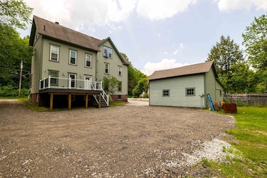 Large new deck on 1st floor, garages to the right