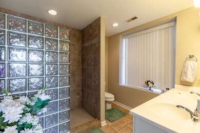 Master bath with double sinks and walk-in shower.