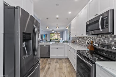 Kitchen featuring decorative light fixtures, ornam