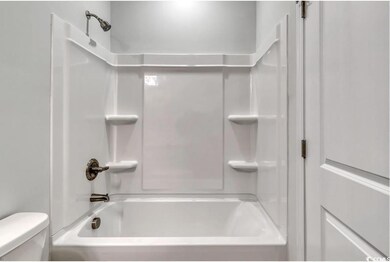 Bathroom featuring bathing tub / shower combinatio