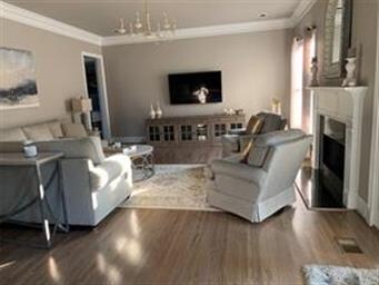 Living room has fireplace,.