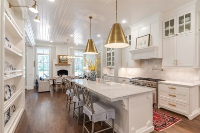 Modern Farm house Kitchen! This kitchen is amazing! Large Island, commercial style appliances!Carera Marble counter tops, Fireplace in breakfast area! Tons of drawers and cabinets!