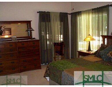 Master Bedroom. Has doors out to back deck and poo