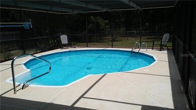 27X24 SCREENED IN POOL DECK OVER LOOKING CONSERVATION AREA