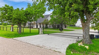 View of gate with a yard