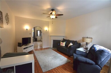 Large living room with hardwood flooring, charming