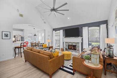 Spacious living room w soaring ceilings & an upgraded fireplace flows into the stunning kitchen w large breakfast nook plus a bonus room off the kitchen.