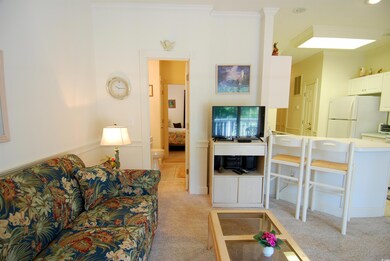 Living room featuring light colored carpet and cro
