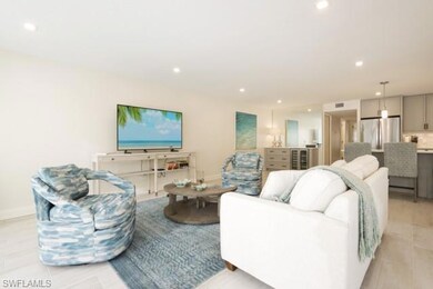 Living area with recessed lighting and wine cooler