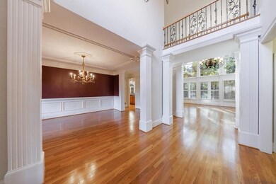 Unfurnished living room with ornate columns, ornam