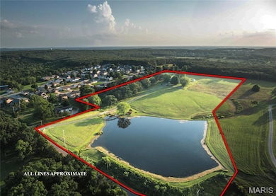 View of property location with a large body of water and property parcel outlined
