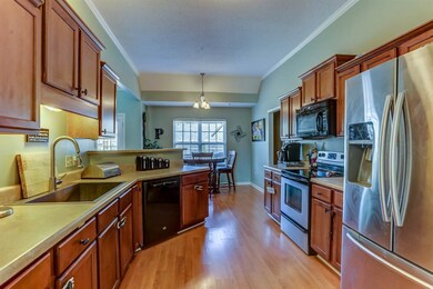 Cooking will be a delight in this incredible eat-in kitchen with cabinet and counter space galore, crown molding, gleaming hardwood floors, breakfast bar, pantry, neutral colors, full complement of appliances.