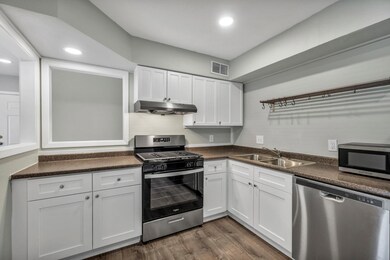 Kitchen featuring stainless steel appliances, a s