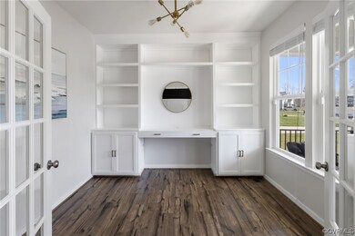 Office space featuring custom built-ins and LVP flooring