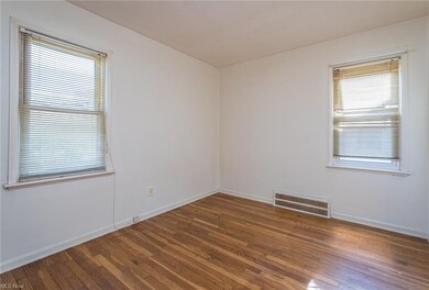 Bedroom 1 first floor with hardwood floors
