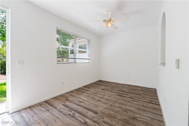 dining room with wood finished floors, a ceiling f
