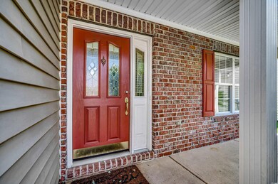 View of exterior entry featuring a porch