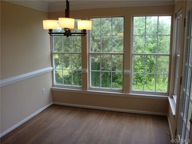 Dining area overlooking private wooded area.