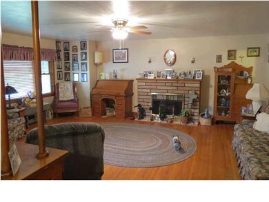 The spacious living room features an electric deco