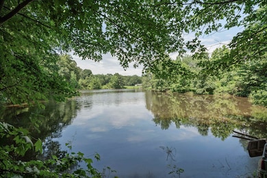 Water view featuring a heavily wooded area