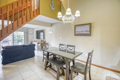 Dining area featuring an inviting chandelier and l