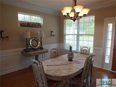 Formal dining room with picture frame molding and 