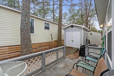 Deck featuring a storage shed