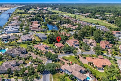 Aerial overview of property's location featuring nearby suburban area and a large body of water