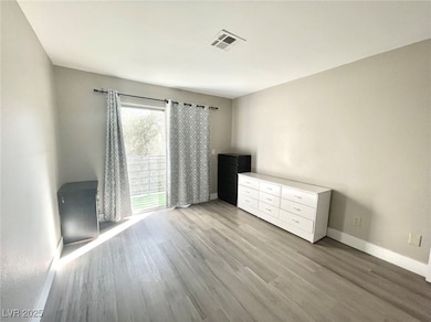Unfurnished bedroom featuring light wood-style flo