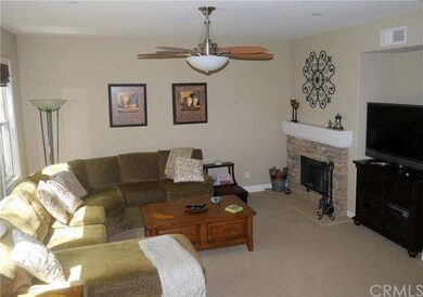 Cozy fireplace and entertainment nook in living ro