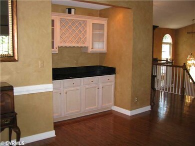 Living Room - Granite top wine bar with upper cabi