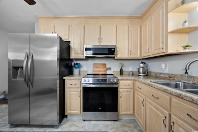 Kitchen features a stainless-steel dishwasher adde