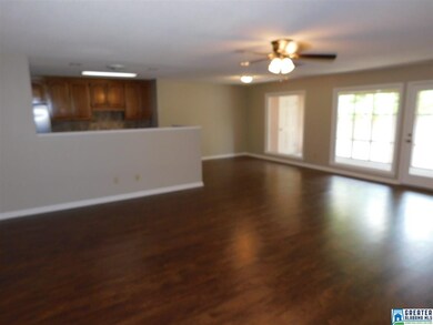 LIVING AREA WITH NEW LAMINATE HARDWOOD FLOORS, AND