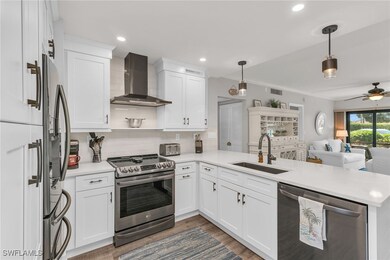 Kitchen with stainless steel appliances, a peninsu
