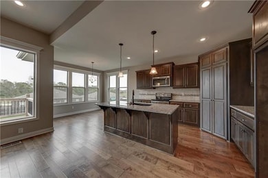 421 Meadowlark Dr, Raymore, MO 64083 - photo 2