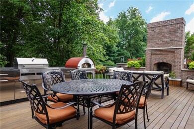 Great entertaining area with brick fireplace, outd